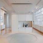 White Painted Inspiration Airy White Painted White Apartment Inspiration For Seating Space Maximized With Round Ottoman And Cabinet Apartments Luminous White Loft With Vibrant Accent Colors In The Middle Of New York City