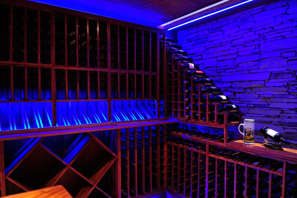 Wine Room St56 Appealing Wine Room Design In ST56 House With Blue LED Lamp And Exposed Stone Wall Also Wooden Storage Dream Homes  Impressive Contemporary Home Gives High Comfort In Your Life