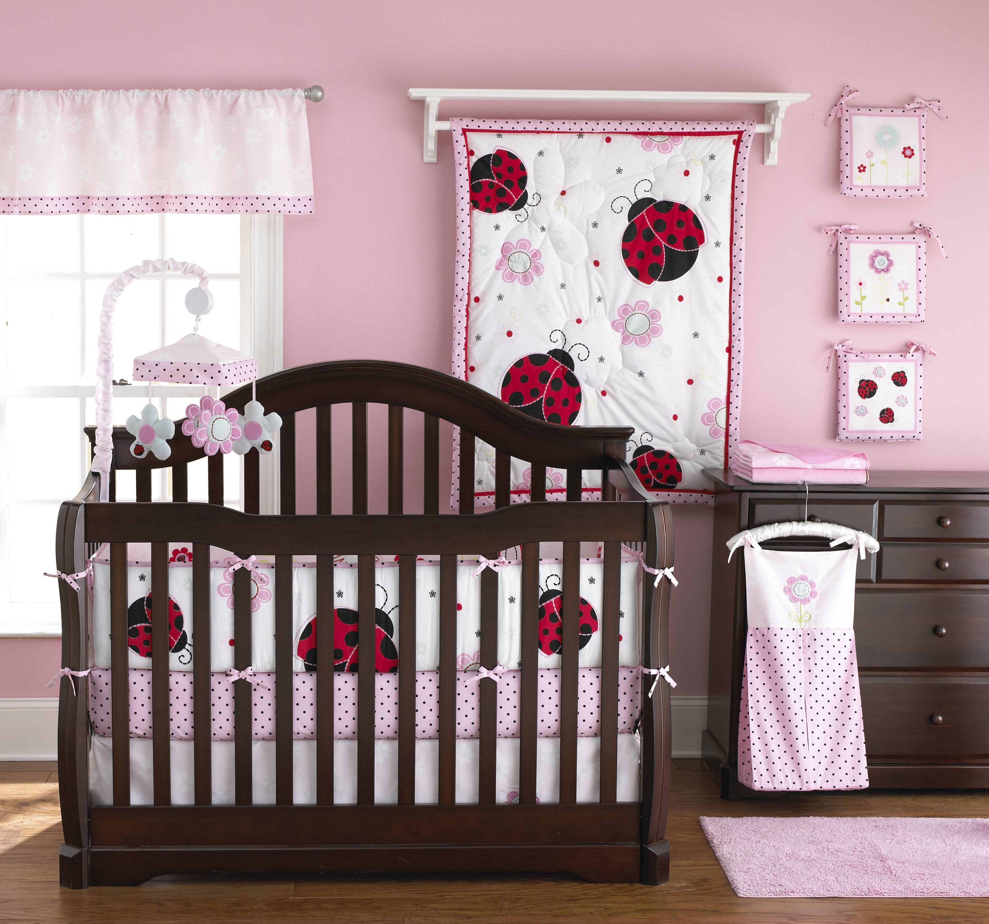 Lady Bug Baby Awesome Lady Bug Themed Pink Baby Girl Nursery Furnished With Brown Wooden Mini Crib Bedding With Floral Splash Kids Room Astonishing Mini Crib Bedding Designed In Minimalist Model For Mansion