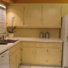 Kitchen Cupboard Creative Best Kitchen Cupboard Paints With Creative Lighting Unit In Cream Wooden Cabinet Furniture Combined With White Countertop Design Kitchens Chic Kitchen Cupboards Paint To Live-up Kitchen Interior