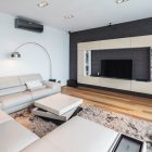 Bucharest Residence Idea Bright Bucharest Residence TV Room Idea Painted In White And Grey Mixed With Cream On Sectional Sofa And TV Stand Living Room Sleek Beige Living Room In Brown Wood Flooring With Grey Wall Accent