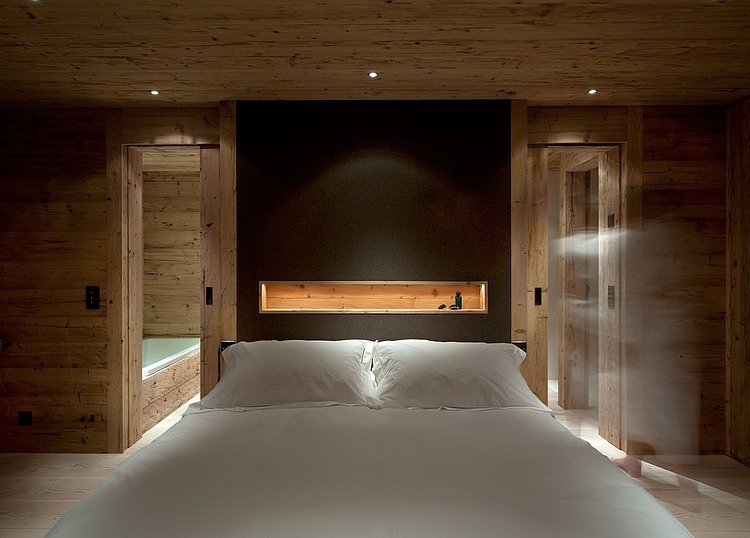 Chalet Gstaad Architectes Bright Chalet Gstaad Amaldi Neder Architectes Master Bedroom Recessed Lamps And LED Light Inside Shelf Decoration Eclectic White Chalet Decoration With Wooden Veneer For Walls