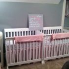 Pink And Cribs Calm Pink And White Mini Cribs Placed Closely To The Light Grey Wall With Quotes Board As Decoration Idea Kids Room Minimalist Mini Cribs In Various Room Designs