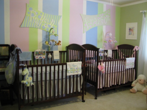 Striped Patterned Where Cheerful Striped Patterned Center Wall Where Black Mini Cribs For Twins Located With Nickname Board As Arts Kids Room Minimalist Mini Cribs In Various Room Designs