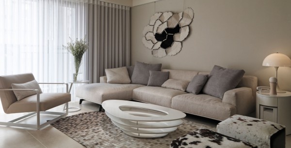 Family Room Oval Comfortable Family Room Idea Integrating Oval Shaped Glass Coffee Table Surrounded By Sofa Chair And Ottomans Decoration  Awesome Neutral Room Designs In Beige Color Combinations