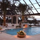 Pool With Plants Eclectic Pool With Stone Potted Plants Beside Pool Of Indoor Pool House Designs Installed Palm Trees With Lamp Beside Pool Swimming Pool Elegant Indoor Pool House Designs Saving Skins From Sun Burning
