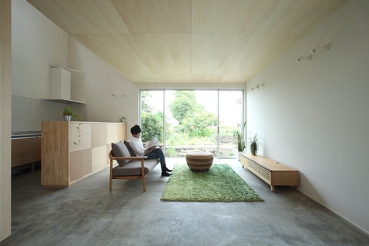 Family Room Woodframe Exquisite Family Room Design With Woodframe Sofa And Green Carpet Area Inside The Azuchi House Sumiou Mizumoto Decoration Outstanding Single Family House In Minimalist Wooden Decoration