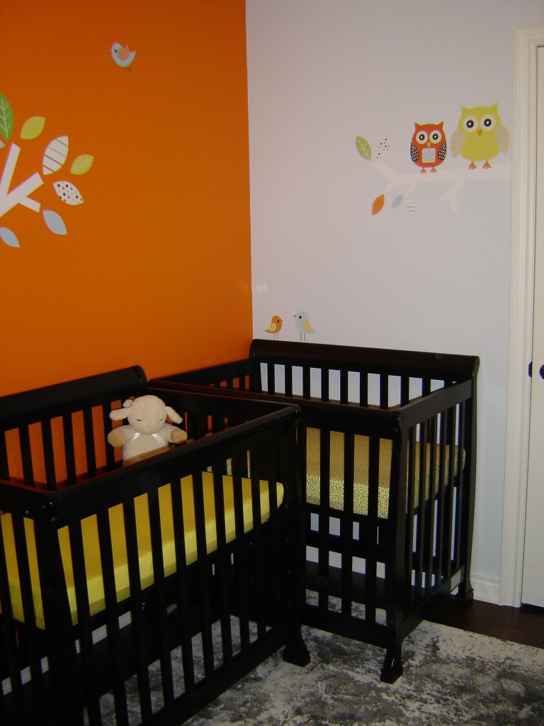 Catching Orange Wall Eye Catching Orange Painted Center Wall Set As Mini Cribs Background Combined With Yellow Accent On Mattress Kids Room Minimalist Mini Cribs In Various Room Designs