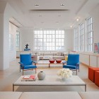 Catching Blue Orange Eye Catching Blue Colored Chairs Orange Stools And White Coffee Table To Enhance White Apartment Inspiration Apartments Luminous White Loft With Vibrant Accent Colors In The Middle Of New York City