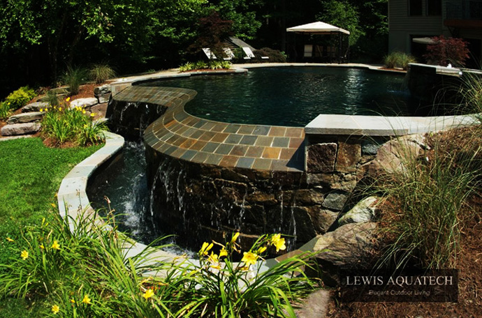 Stone Details Interesting Fabulous Stone Details In The Interesting Pool Another Fine Project By Lewis Aquatech Beside Grass Yard Dream Homes Magnificent Outdoor Swimming Pool With Sensational Backyard And Patio