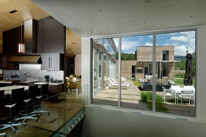 Kitchen In With Fascinating Kitchen In Lord Residence With Long Island And Some Black Stools Under The Brown Ceiling Architecture Unique Pond House Design For Your Private Relaxing Place