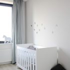 White Themed Interior Fascinating White Themed Baby Nursery Interior Style Furnished With White Crib And Black Throw Pillow On Floor Kids Room Lavish White Crib Designed In Contemporary Style For Main Furniture