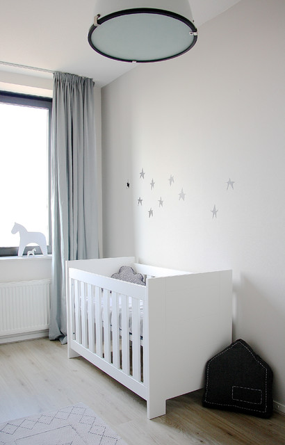 White Themed Interior Fascinating White Themed Baby Nursery Interior Style Furnished With White Crib And Black Throw Pillow On Floor Kids Room Lavish White Crib Designed In Contemporary Style For Main Furniture