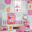 Mini Crib By Feminine Mini Crib Bedding Covered By Patterned Pink And Orange Floral Wall Art Installed On The Wall Of Nursery Kids Room Astonishing Mini Crib Bedding Designed In Minimalist Model For Mansion