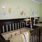 Winnie The Baby Funny Winnie The Pooh Themed Baby Nursery Involving Small Decals Studded On Green Wall Above Best Baby Cribs Kids Room Marvelous Best Baby Cribs Designed In Twins Model For Small Room