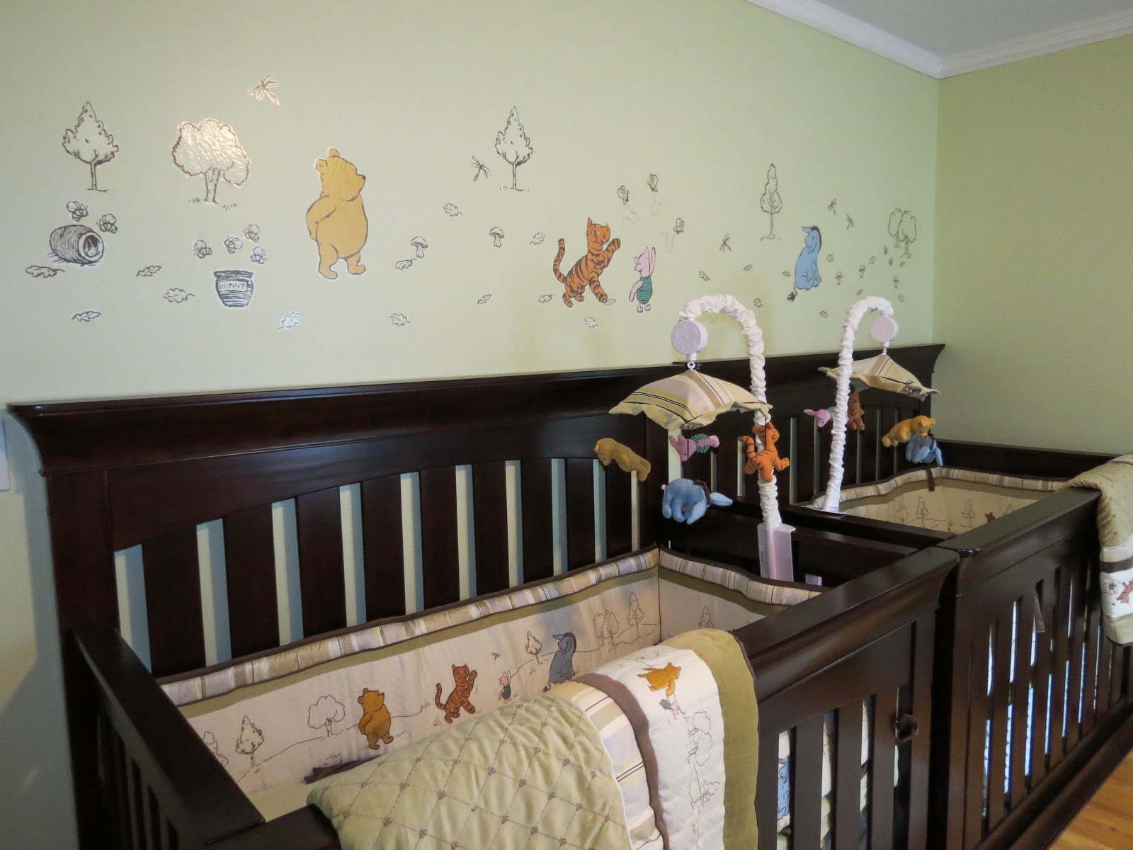 Winnie The Baby Funny Winnie The Pooh Themed Baby Nursery Involving Small Decals Studded On Green Wall Above Best Baby Cribs Kids Room Marvelous Best Baby Cribs Designed In Twins Model For Small Room