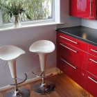 Glossy Stools Kicthen Interesting Glossy Stools Beside Red Kitchen Island Using Modern Kitchen Design On Wooden Striped Floor Involved Glass Potted Plants Kitchens Fascinating Kitchen Decoration That Transform The Home Into Modern Design