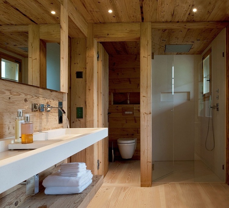 Chalet Gstaad Architectes Minimalist Chalet Gstaad Amaldi Neder Architectes Master Bath With Hidden Toilet And Shower With Glass Decoration Eclectic White Chalet Decoration With Wooden Veneer For Walls