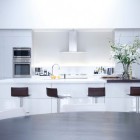 Chic Montreal Parallel Nice Chic Montreal Penthouse Open Parallel Kitchen Idea Displaying Clean White Island And Cabinetry With Brown Stools Decoration Modest Home Decor And Modern Furniture Of Monochromatic Themes