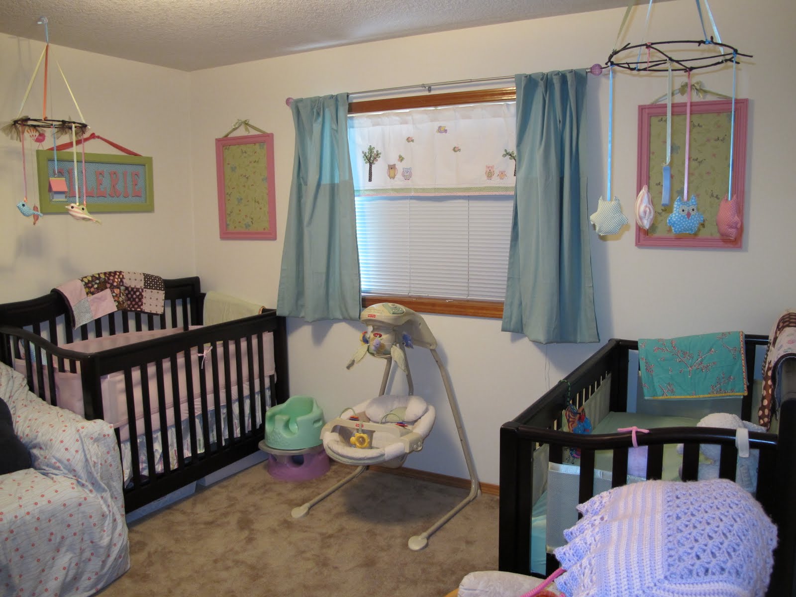 White Painted With Ordinary White Painted Nursery Interior With Black Painted Best Baby Cribs For Twins With Blue Pink And Green Splash Kids Room Marvelous Best Baby Cribs Designed In Twins Model For Small Room
