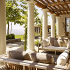 Garden Landscape Pergola Precious Garden Landscape In Patio Pergola Cozy Outdoor Sofa With Cute Pillows Tough White Pillars Nice Ornamental Plants In Stone Planter Outdoor Elegant Terrace With Natural Patio Pergola For The Modern Homes