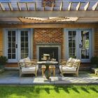 Patio Pergola Fireplace Rustic Patio Pergola And Warm Fireplace French Door Wood Coffee Table White Padded Sofa Sculptured Ornamental Plants Outdoor Elegant Terrace With Natural Patio Pergola For The Modern Homes