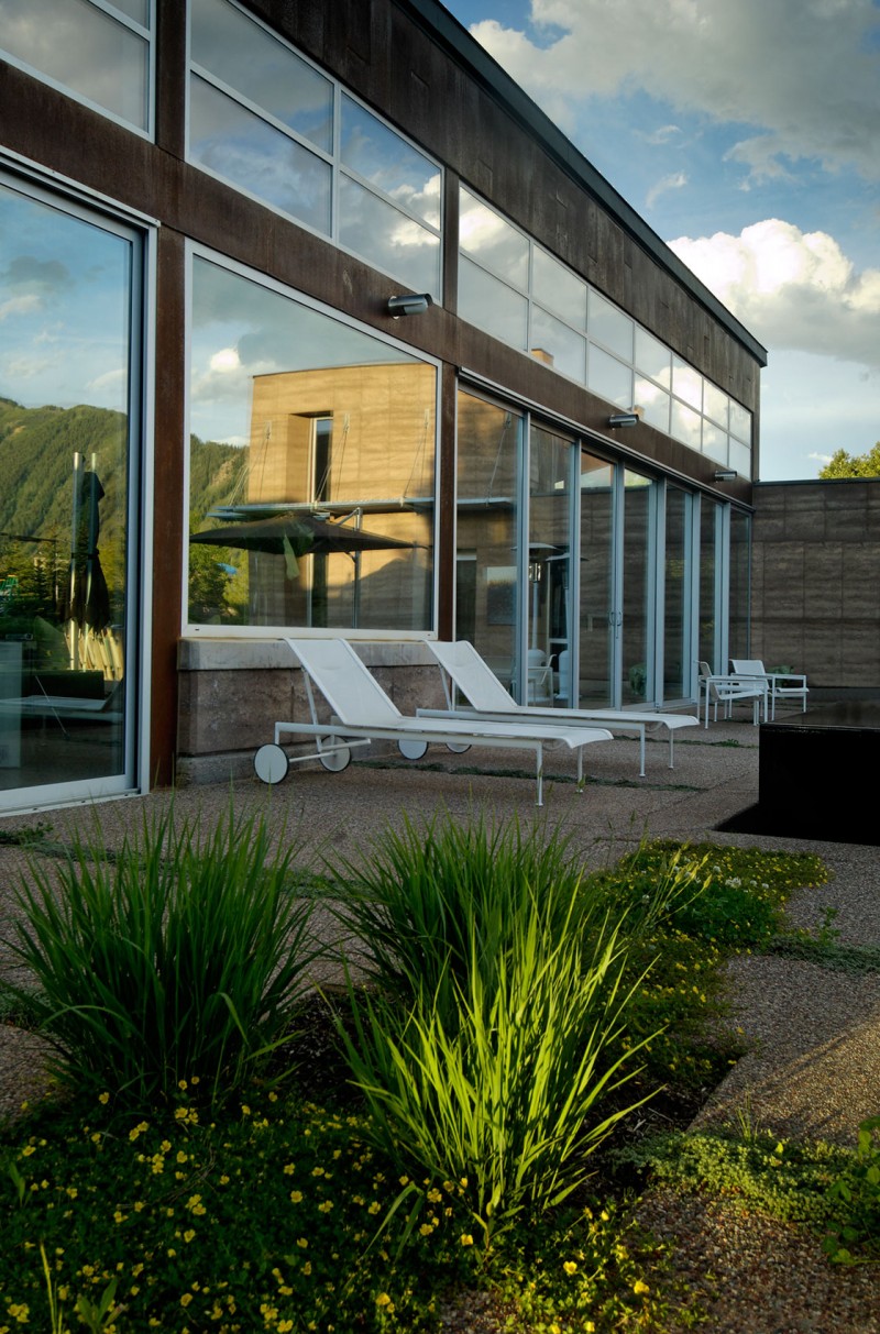 Terrace Outside Residence Sensational Terrace Outside The Lord Residence With White Beach Benches And Brown Floor Near Reflective Glass Windows Architecture Unique Pond House Design For Your Private Relaxing Place