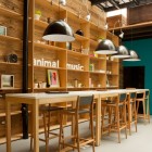 Wooden Stools Table Sensational Wooden Stools And Wooden Table In The Animal Music Studio With Some Black Curve Lamps Decoration Trendy And Fascinating Office Design Of The Animal Music Project