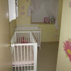 White Painted Baby Simple White Painted Wooden Best Baby Cribs Placed Inside Bright Cream Painted Nursery Room With Pink Splash Kids Room Marvelous Best Baby Cribs Designed In Twins Model For Small Room