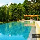Wooden Pergola Floor Simple Wooden Pergola And Stone Floor Beside The Long Blue Infinity Pool Another Fine Project By Lewis Aquatech Dream Homes Magnificent Outdoor Swimming Pool With Sensational Backyard And Patio