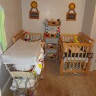 Cream Themed With Small Cream Themed Baby Nursery With Double Mini Cribs And Open Diaper Tray For Changing Baby Diaper Kids Room Minimalist Mini Cribs In Various Room Designs