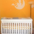 Orange Themed Ideas Stunning Orange Themed Nursery Decor Ideas With White Fishing Boy On The Moon Decal Above The Crib With Mattress Decoration Lovely Nursery Decor Ideas With Secured Bedroom Appliances