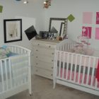 Baby Girl Nursery Trendy Baby Girl And Boy Nursery Idea Involving White Painted Best Baby Cribs With Dresser And Wall Arts Kids Room Marvelous Best Baby Cribs Designed In Twins Model For Small Room