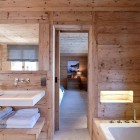 Chalet Gstaad Architectes Warm Chalet Gstaad Amaldi Neder Architectes Master Bathroom With Mounted Tub And Floating Vanity Decoration Eclectic White Chalet Decoration With Wooden Veneer For Walls (+18 New Images)