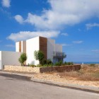 House A Land Amazing House A Involved Dry Land With Dry Plants Surrounded It And Stone Patterned Fence Around It With Blue Atmosphere Decoration Surprising Home Decoration With An Open Landscape Of Seaside Views