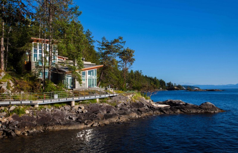 Pender Harbour Asymmetric Amazing Pender Harbour House With Asymmetric Roof And Glass Wall Shady Greenery Long Bridge With Metallic Railing Architecture Stunning Waterfront House With Lush Forest Landscape