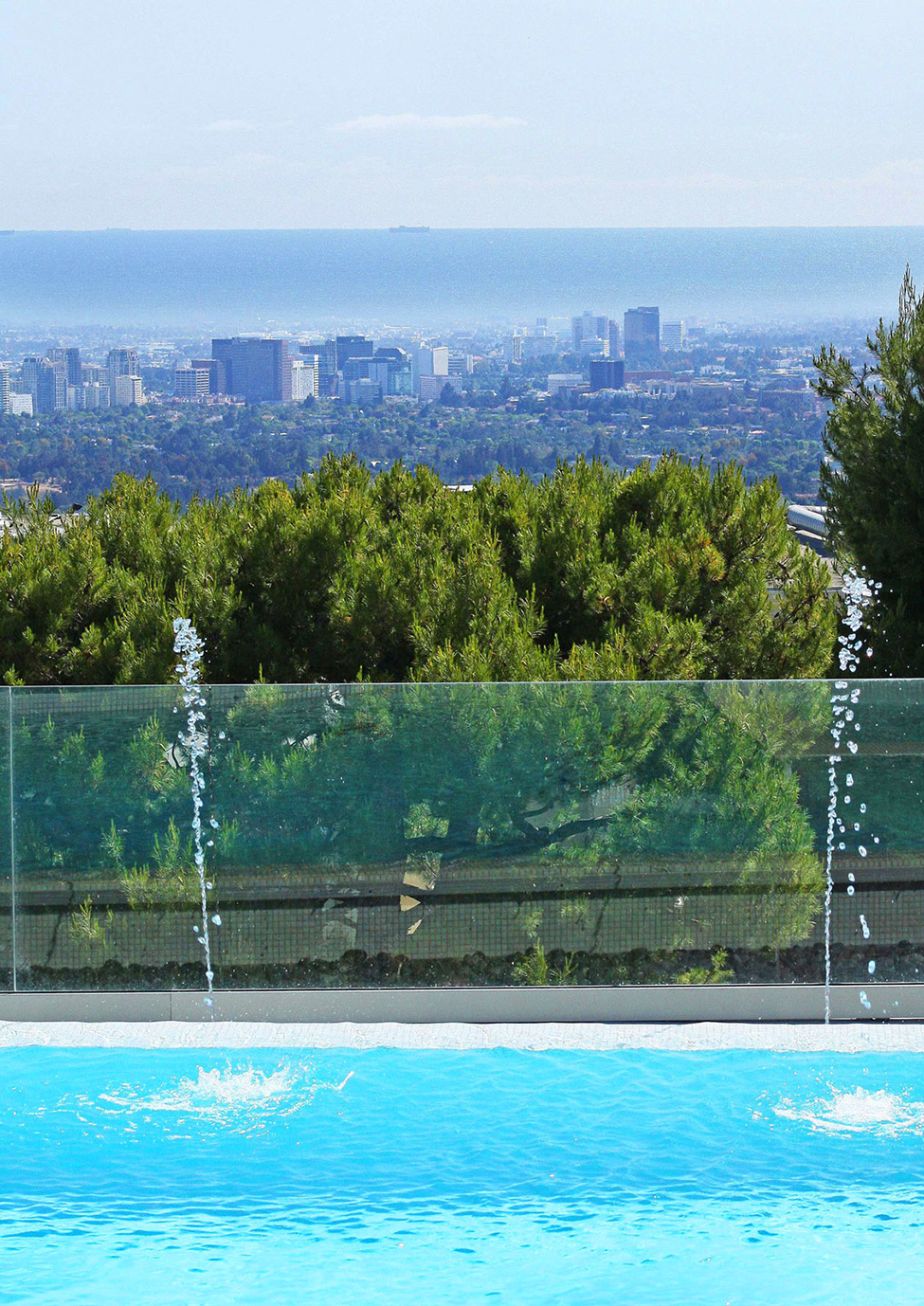 Outdoor Relaxing In Astounding Outdoor Relaxing Space Design In Beverly Hills Mansion With Transparent Glass Handrail And Soft Blue Pool Architecture Stunning Beverly Hills House With Modern Interior Decorating Ideas