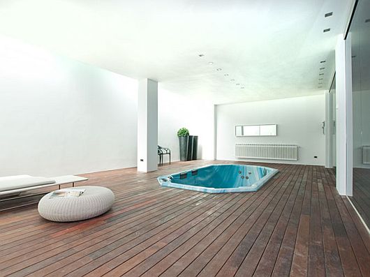 Bath Tub Laminate Blue Bath Tub Embedded On Laminate Wood Floors Of Contemporary Bathroom In Sleek White Contemporary Villa In Madrid Apartments  Sophisticated Scandinavian Living Rooms As Inspirational Design For You