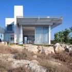 Stones In The Captivating Stones In Front Of The Artistic Clutter House Installed On The Dry Lands With Dry Plants In Front Of It Decoration Surprising Home Decoration With An Open Landscape Of Seaside Views