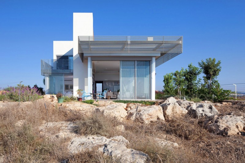 Stones In The Captivating Stones In Front Of The Artistic Clutter House Installed On The Dry Lands With Dry Plants In Front Of It Decoration  Surprising Home Decoration With An Open Landscape Of Seaside Views