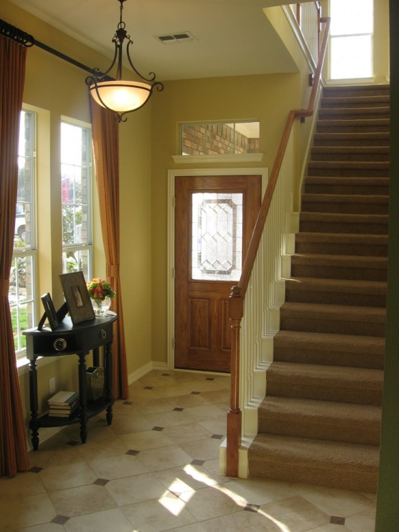 Foyer Design Styled Charming Foyer Design With Classic Styled Pendant Lamp Above Tiled Floor Beside Staircase Completed Wooden Cabinets Decoration  Creative Home Interior In Various Foyer Appearances