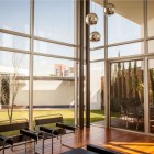 Iron Pendant The Charming Iron Pendant Lamp In The Living Room In Casa Villa De Loreto Residence With White Glass Windows Dream Homes Spacious Modern Concrete House With Steel Frame And Glass Elements