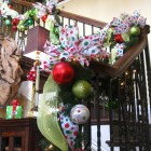 Jinggle Bells Dot Cheerful Jingle Bells With Polka Dot Patterned Ribbon Attached As Staircase Christmas Decor With Green Plantation Decoration Magnificent Christmas Decorations On The Staircase Railing