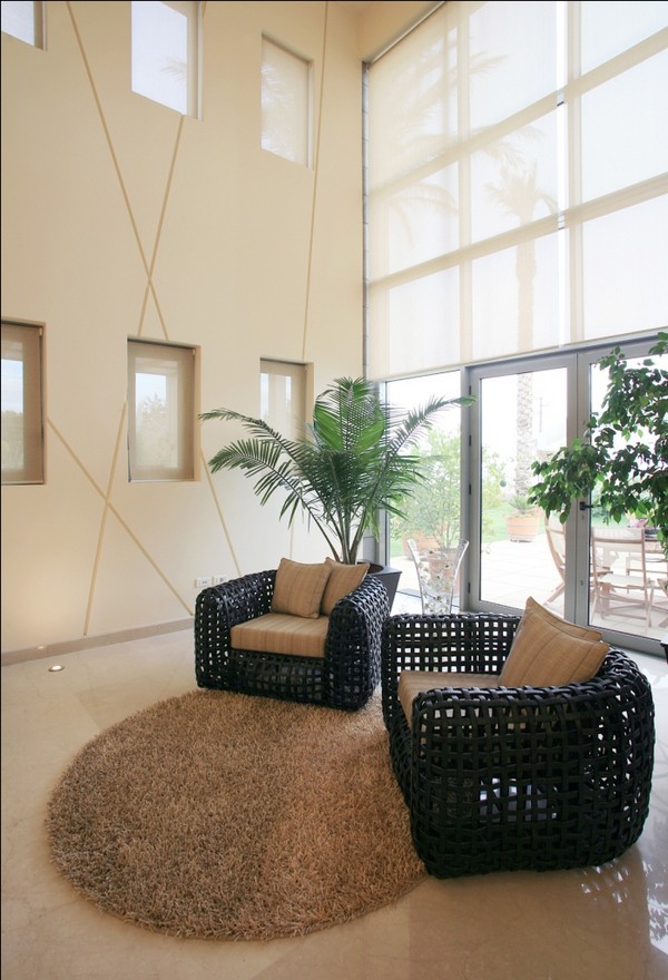 Black Chairs Fur Chic Black Chairs Facing Cream Fur Rug In Ghazale Residence That Taupe Pillows Accompany The Planters Decor Dream Homes  Wonderful Outdoor Features Ideas Inspired With Modern Style