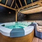 Dream Backyard Area Contemporary Dream Backyard Home Soaking Area With Luxurious Curved Hot Tub With Wooden Base On Flooring Swimming Pool Beautiful Pool Backyard For Luxury And Fresh Backyard Look