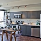 Kitchen Interior Black Contemporary Kitchen Interior Design With Black Painted Kitchen Cabinet And Metal Refrigerator Also Wooden Kitchen Table Kitchens Colorful Kitchen Cabinets For Eye Catching Paint Colors