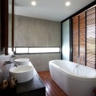 Porcelain Bathtub Glass Cool Porcelain Bathtub Wood Floor Glass Wall Tough Marble Wall Shiny Ceiling Lights Concrete Bathroom Vanity With Round Sinks Architecture Elegant Concrete Home With Spacious And Modern Style In Thailand