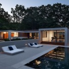 White Wooden The Cool White Wooden Lounge Beside The Swimming Pool In Gray Tiled Floor In The New Canaan Residence Dream Homes Charming Modern House With Beautiful Courtyard And Structures