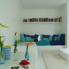 Blue Throw White Cozy Blue Throw Pillows And White Bookshelf In The Casa Kolonihagen Norway Sitting Space With White Table Dream Homes Stunning Holiday House Design As Best Choice For Spending Summer Holiday