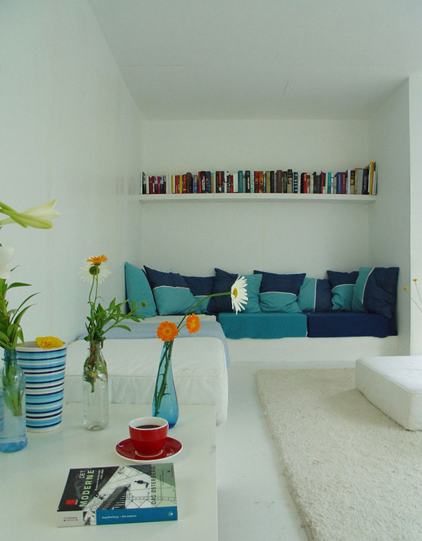 Blue Throw White Cozy Blue Throw Pillows And White Bookshelf In The Casa Kolonihagen Norway Sitting Space With White Table Dream Homes  Stunning Holiday House Design As Best Choice For Spending Summer Holiday